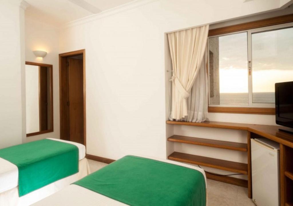 Postel nebo postele na pokoji v ubytování Hotel Irotama XXI