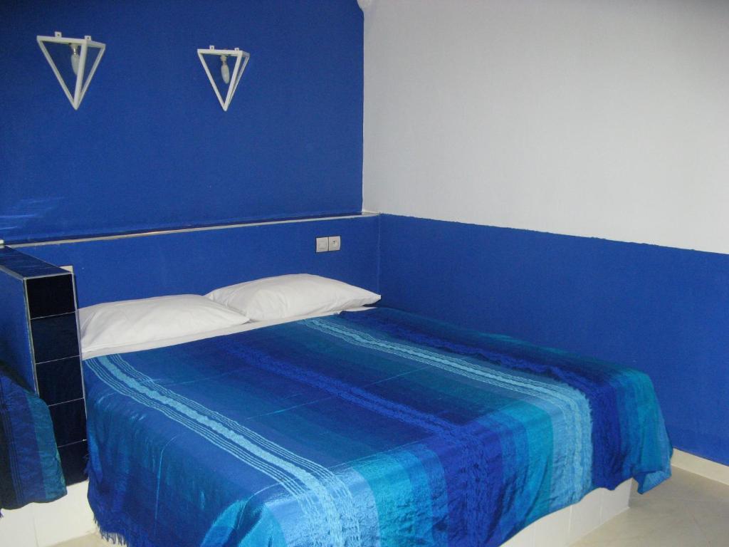 Postel nebo postele na pokoji v ubytování Auberge Tinit