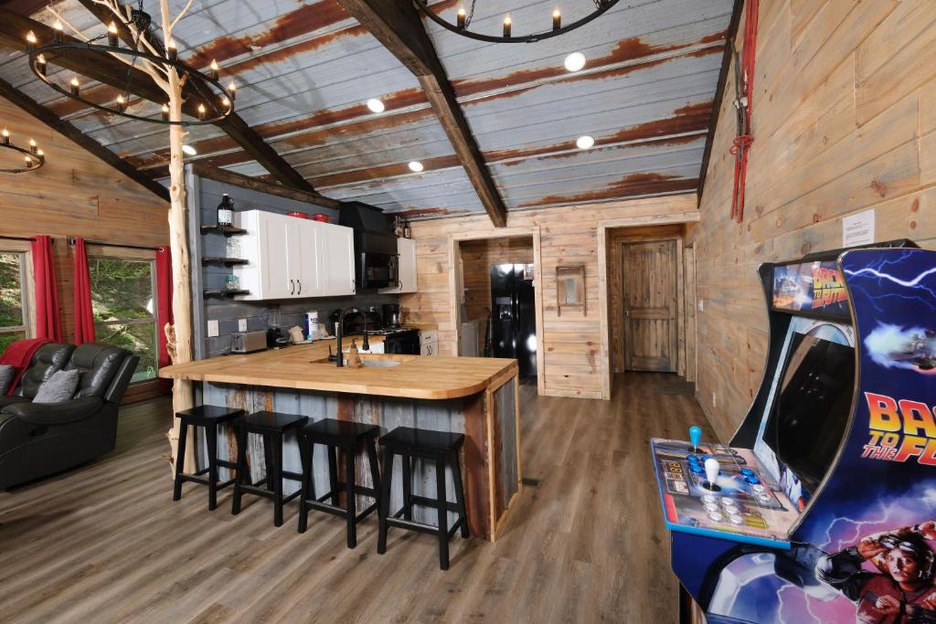 a cabin with a bar and a video game at Newly renovated 2 BR in convenient location! in Sevierville