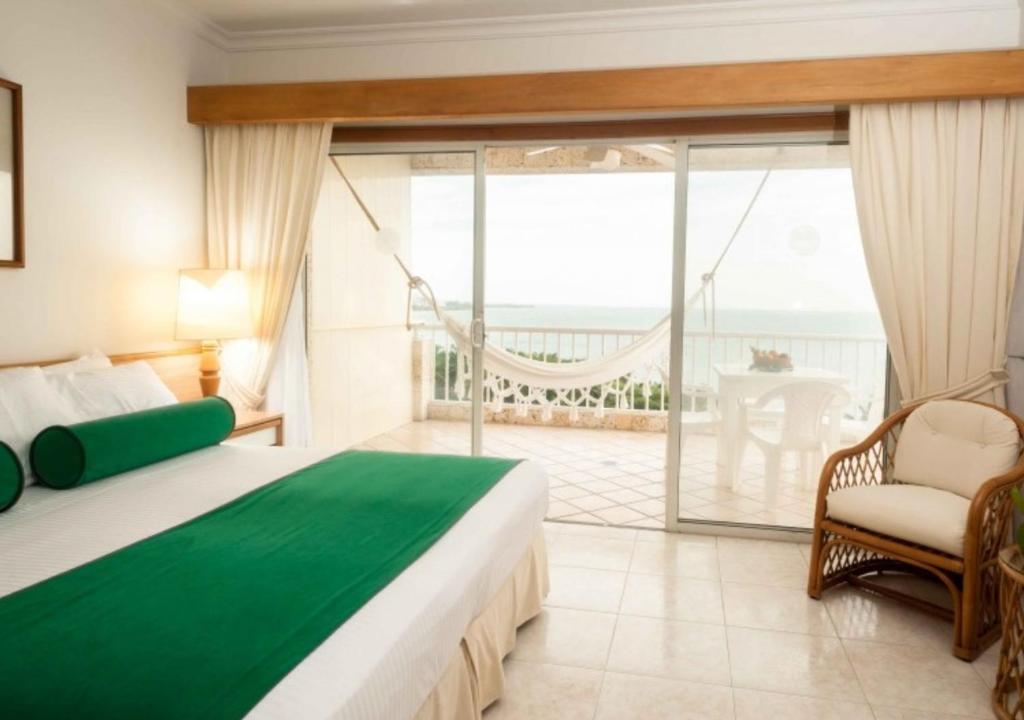 Postel nebo postele na pokoji v ubytování Hotel Irotama XXI