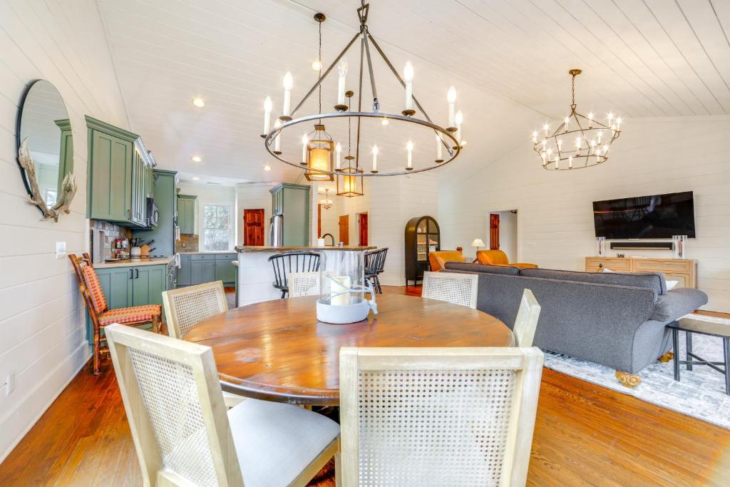 a kitchen and dining room with a table and chairs at Incredible Lake Glenville Views Cashiers Home in Cashiers