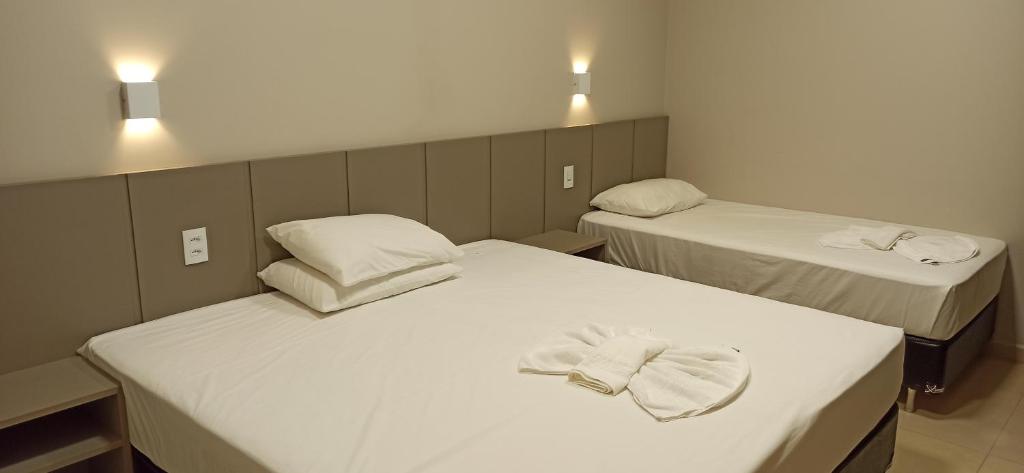Postel nebo postele na pokoji v ubytování Sleep Hotel