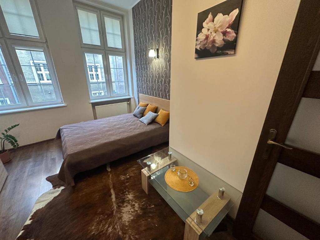 Posteľ alebo postele v izbe v ubytovaní Gdańskie Apartamenty - Apartamenty na Świetego Ducha z 2 sypialniami