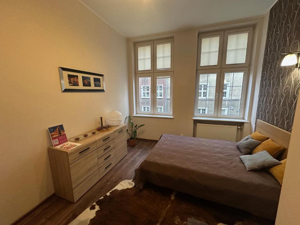 Posteľ alebo postele v izbe v ubytovaní Gdańskie Apartamenty - Apartamenty na Świetego Ducha z 2 sypialniami