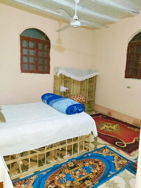 a bedroom with two beds in a room at Sunset Mirage in Luxor