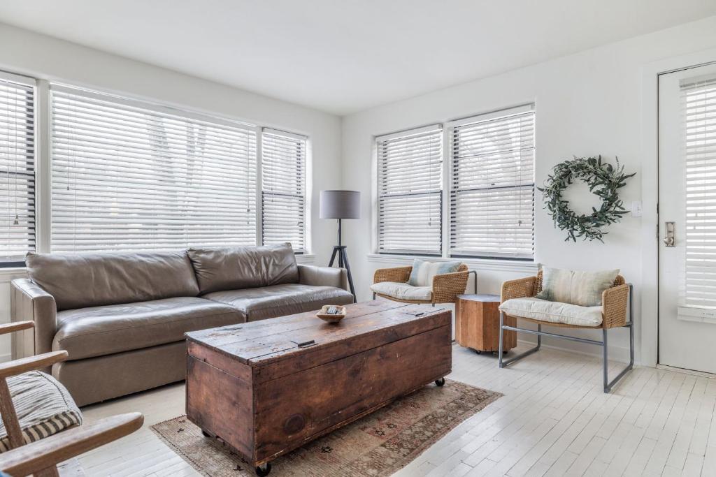 a living room with a couch and a coffee table at Hygge House in Harbert