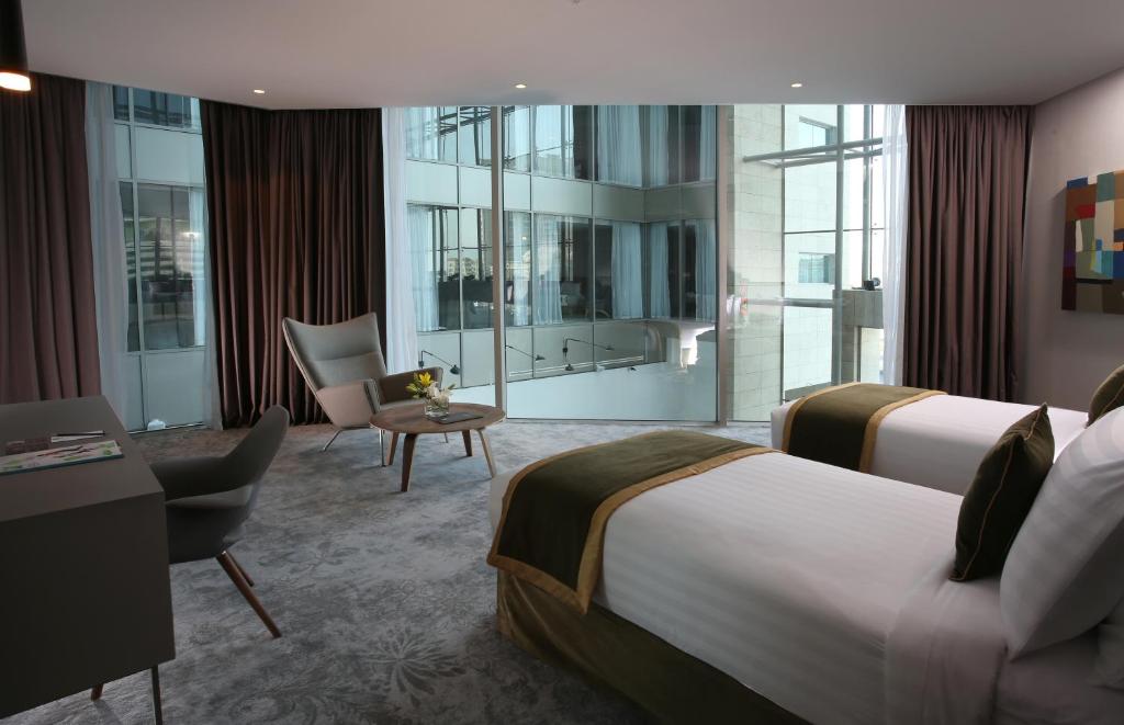 Postel nebo postele na pokoji v ubytování Ibis Styles Dubai Jumeira
