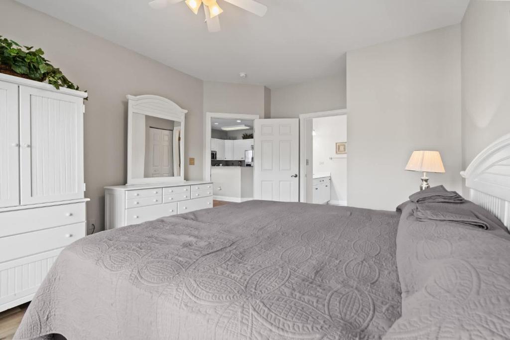 Ein Bett oder Betten in einem Zimmer der Unterkunft World Tour Golf Resort 206
