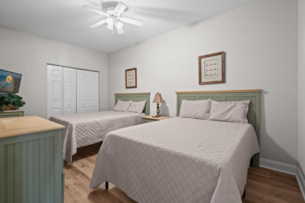 Ein Bett oder Betten in einem Zimmer der Unterkunft World Tour Golf Resort 206