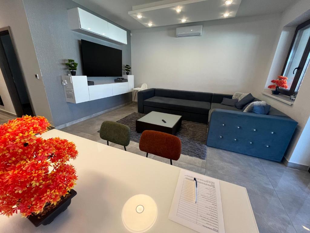 TV a/nebo společenská místnost v ubytování VRG 1 Exkluzív Apartman