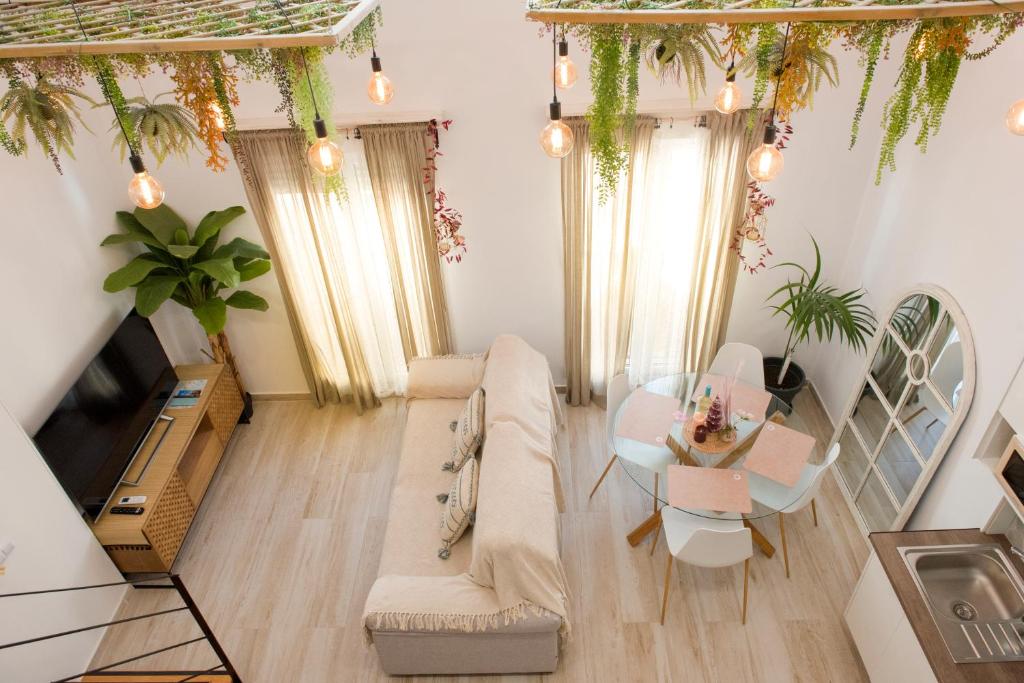 a living room with a couch and a table at Agua Viva Deluxe in Málaga