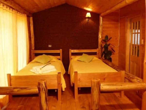 Postel nebo postele na pokoji v ubytování Hacienda Ecuestre