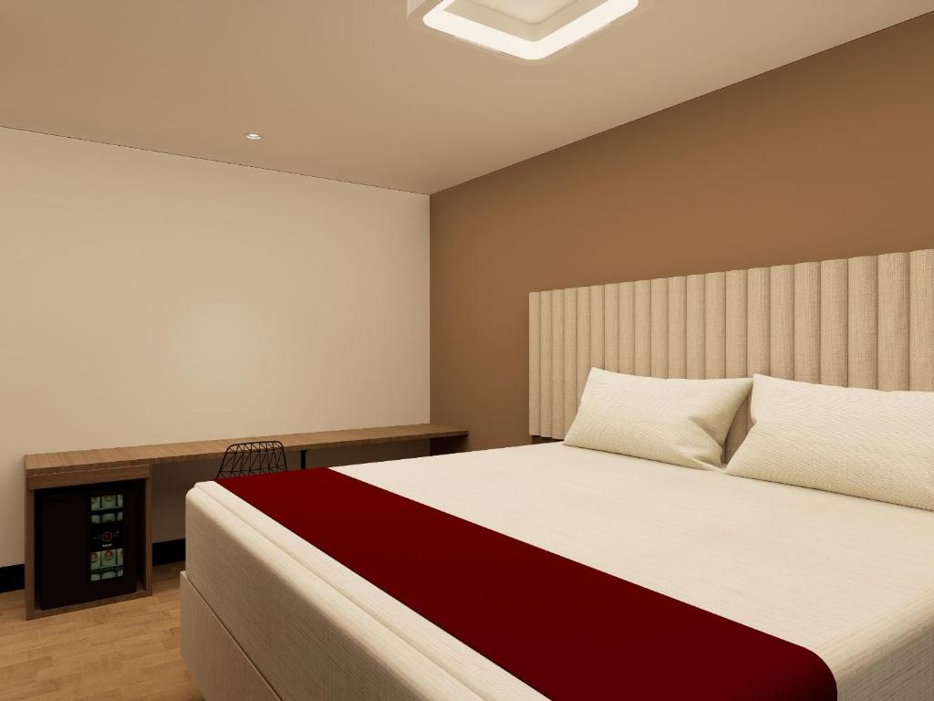 Postel nebo postele na pokoji v ubytování Hotel Continental ByHours