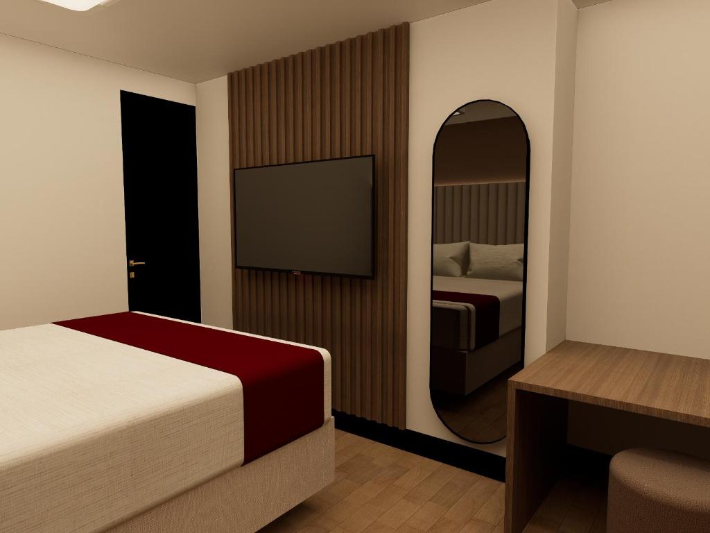 Postel nebo postele na pokoji v ubytování Hotel Continental ByHours
