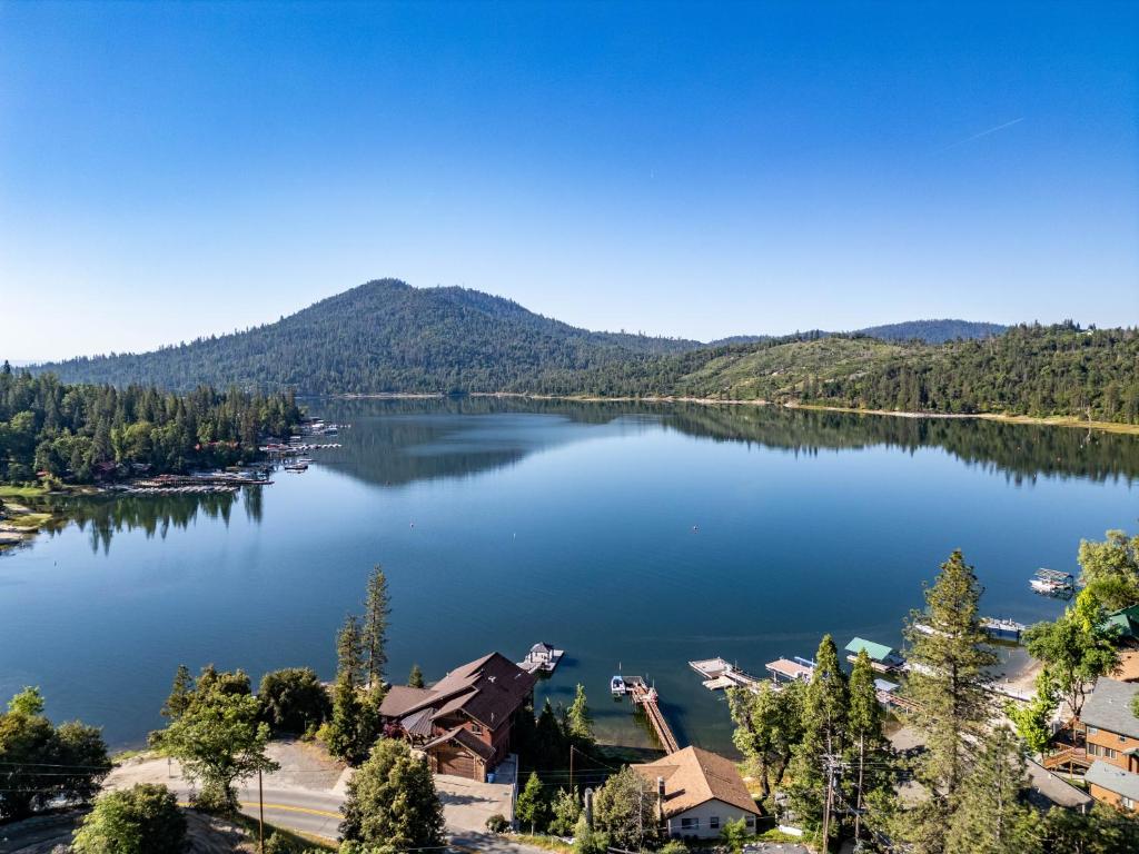 an aerial view of a lake with mountains in the background at Falls Lake View in Bass Lake