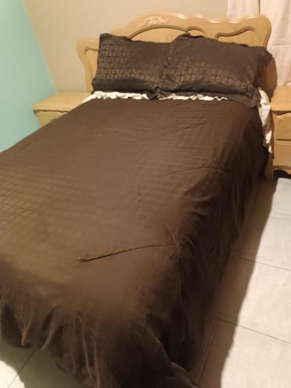 Postel nebo postele na pokoji v ubytování Hospedaje Barato Mi Casita de Colores