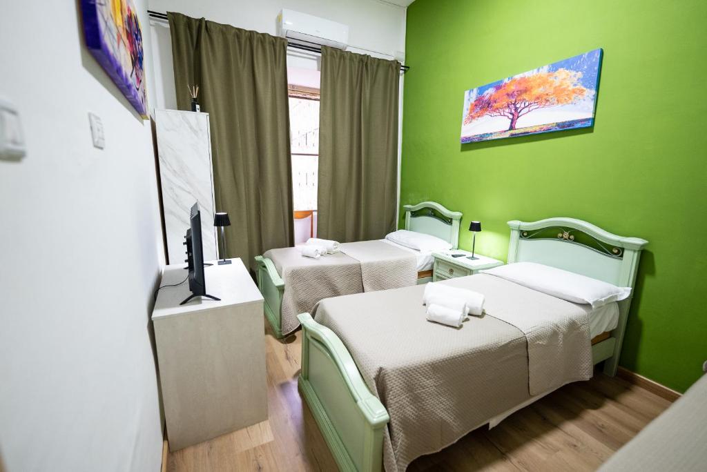 Łóżko lub łóżka w pokoju w obiekcie home Joséphine, a due passi dalla Reggia
