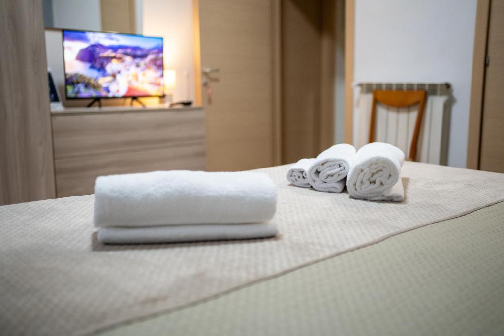 Łóżko lub łóżka w pokoju w obiekcie home Joséphine, a due passi dalla Reggia