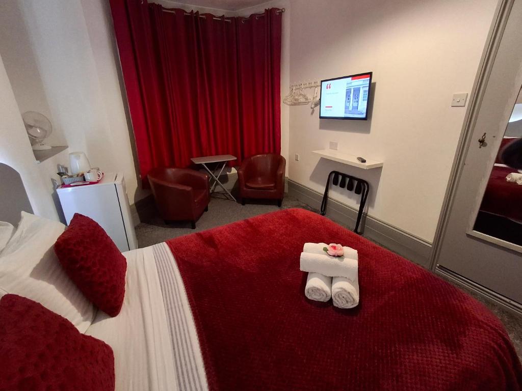 Postel nebo postele na pokoji v ubytování St Albans Guest House, Dover