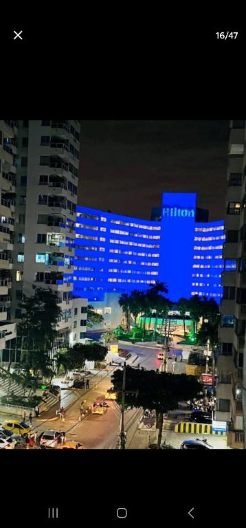 a view of a city at night with blue lights at Marinares apartamento in Cartagena de Indias