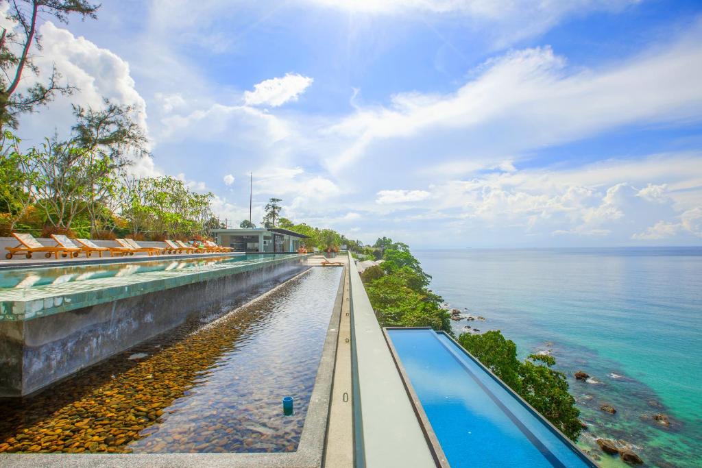 a view of the ocean from a resort infinity pool at Norn Talay Surin Beach Phuket in Surin Beach