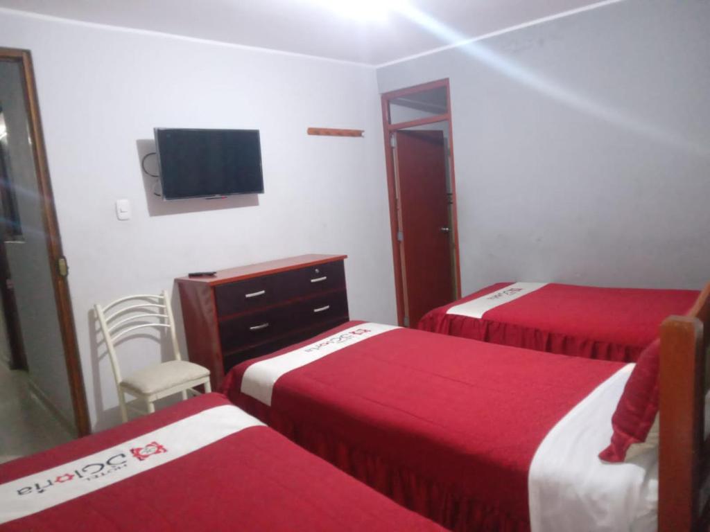 Postel nebo postele na pokoji v ubytování Hotel D'Gloria