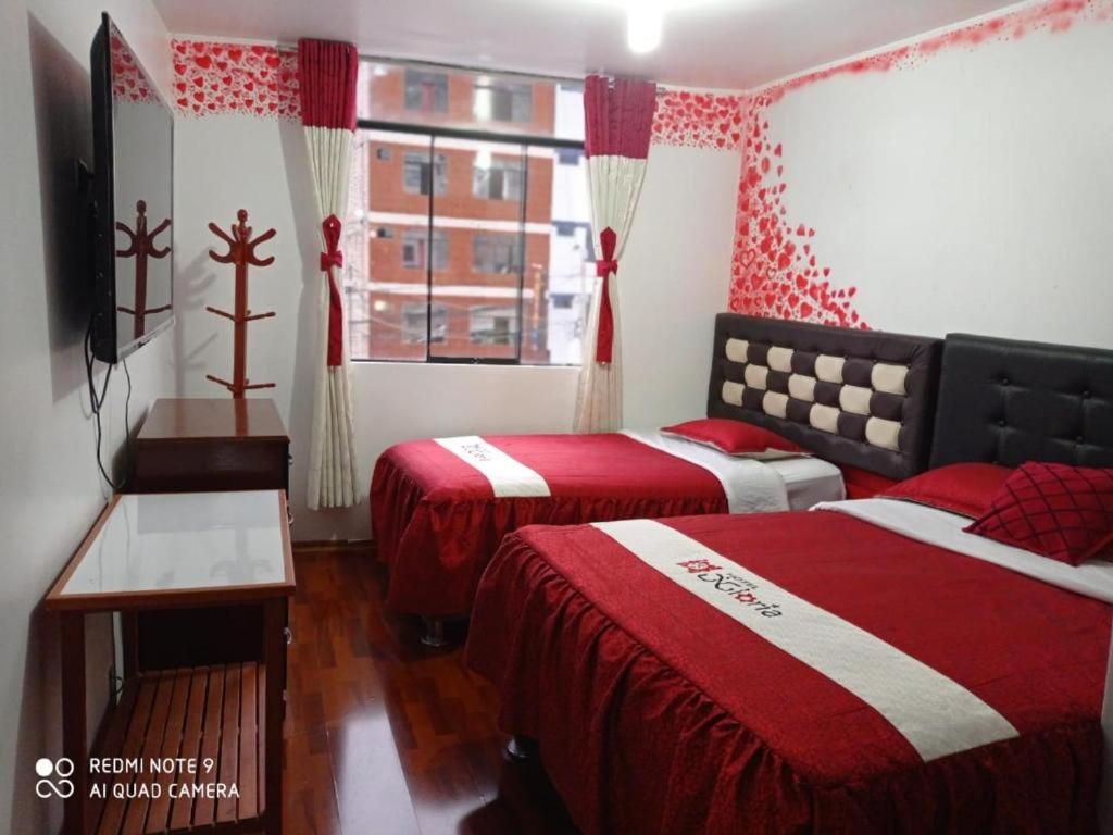 Postel nebo postele na pokoji v ubytování Hotel D'Gloria