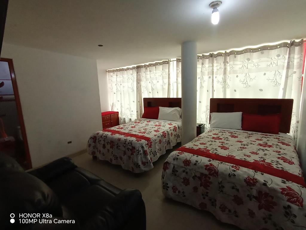 Postel nebo postele na pokoji v ubytování Hotel D'Gloria