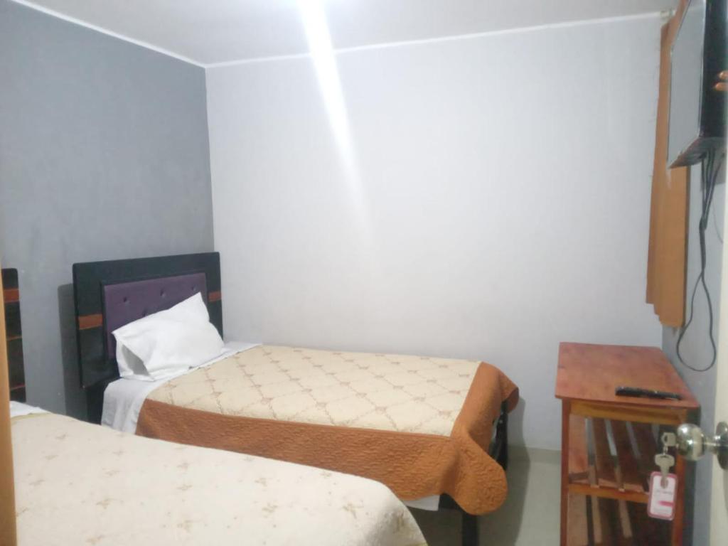 Postel nebo postele na pokoji v ubytování Hotel D'Gloria
