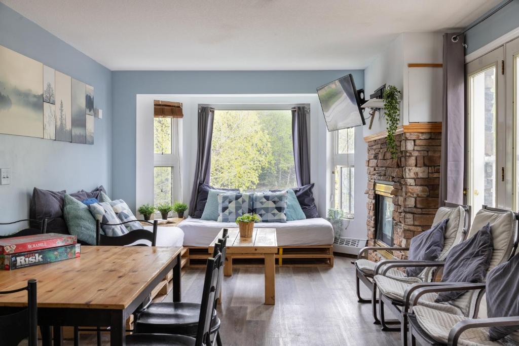 a living room with a couch and a table at Samesun Banff Hostel in Banff