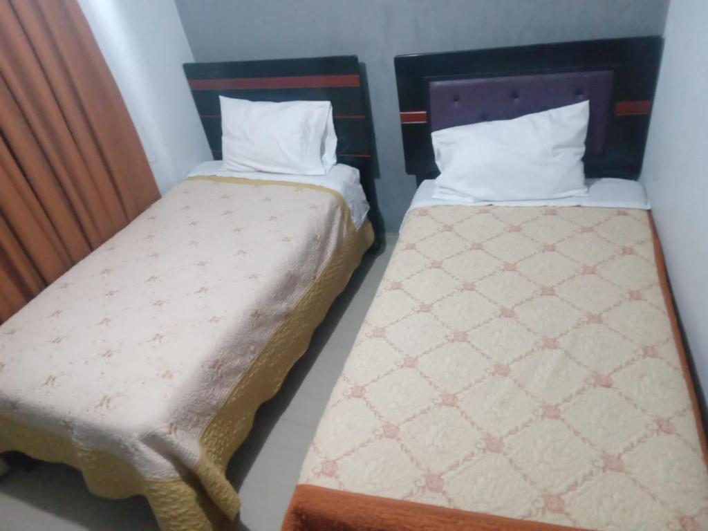 Postel nebo postele na pokoji v ubytování Hotel D'Gloria