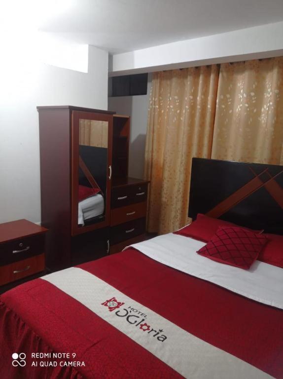 Postel nebo postele na pokoji v ubytování Hotel D'Gloria