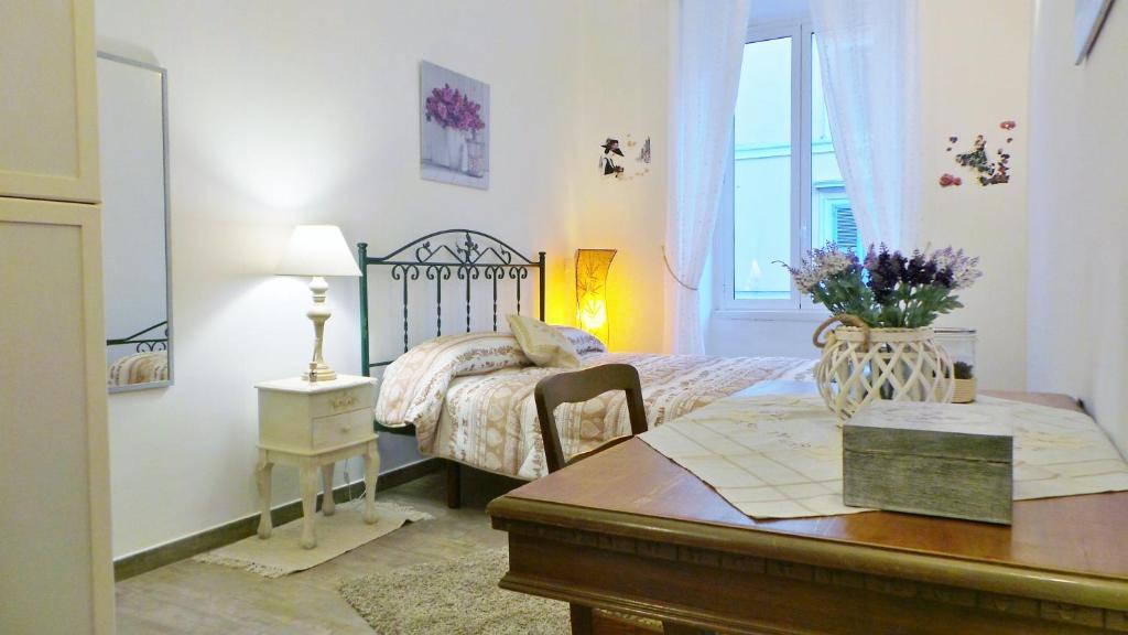 A bed or beds in a room at Cuore di Testaccio Apartment