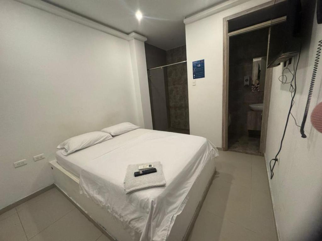 Postel nebo postele na pokoji v ubytování Hotel La Esmeralda