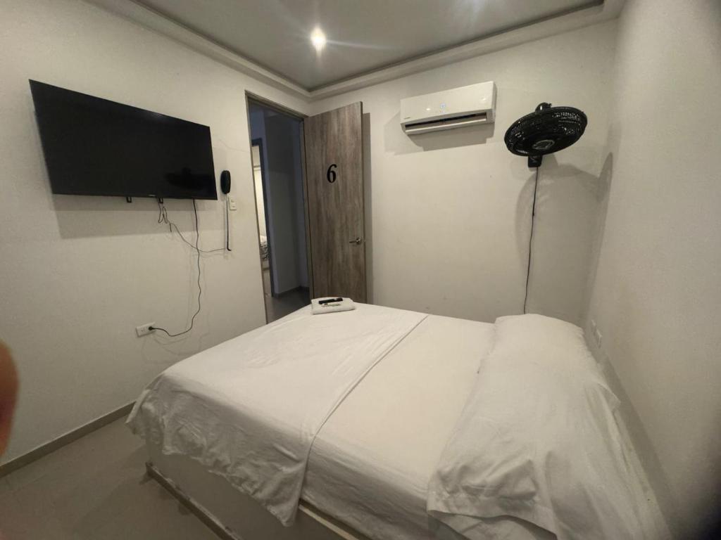 Postel nebo postele na pokoji v ubytování Hotel La Esmeralda