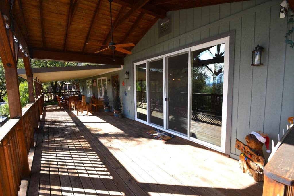 a porch of a house with sliding glass doors at Ledge House-Lake Area in Bass Lake