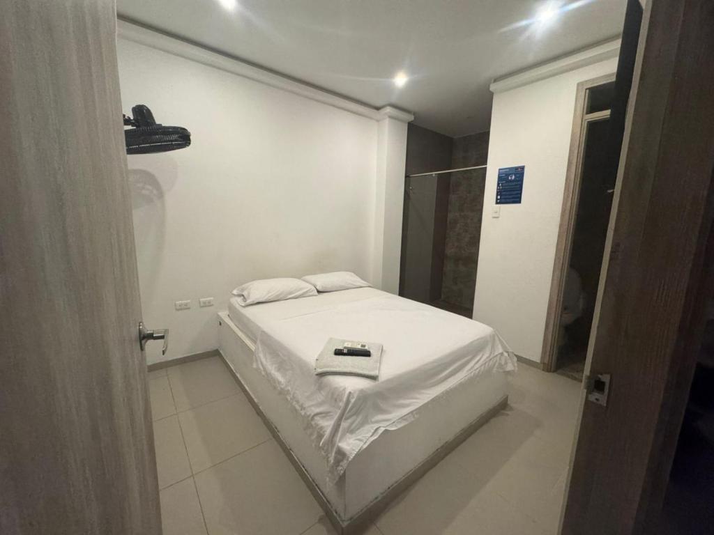 Postel nebo postele na pokoji v ubytování Hotel La Esmeralda