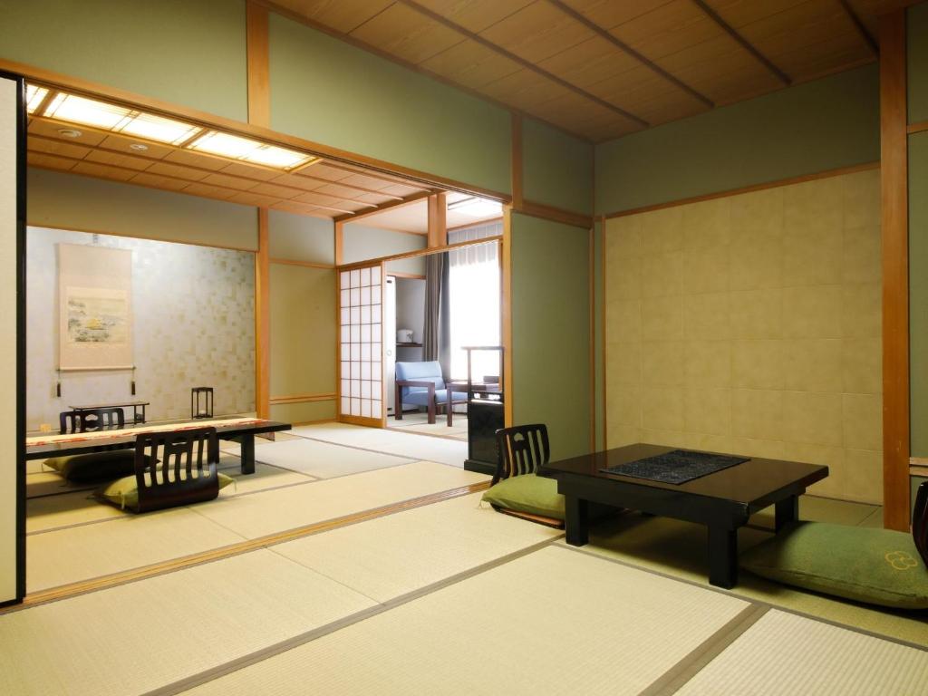 Postel nebo postele na pokoji v ubytování Arima Hot Spring Ryokan Hanamusubi