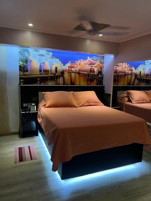 Postel nebo postele na pokoji v ubytování Hotel Santiago Yungay