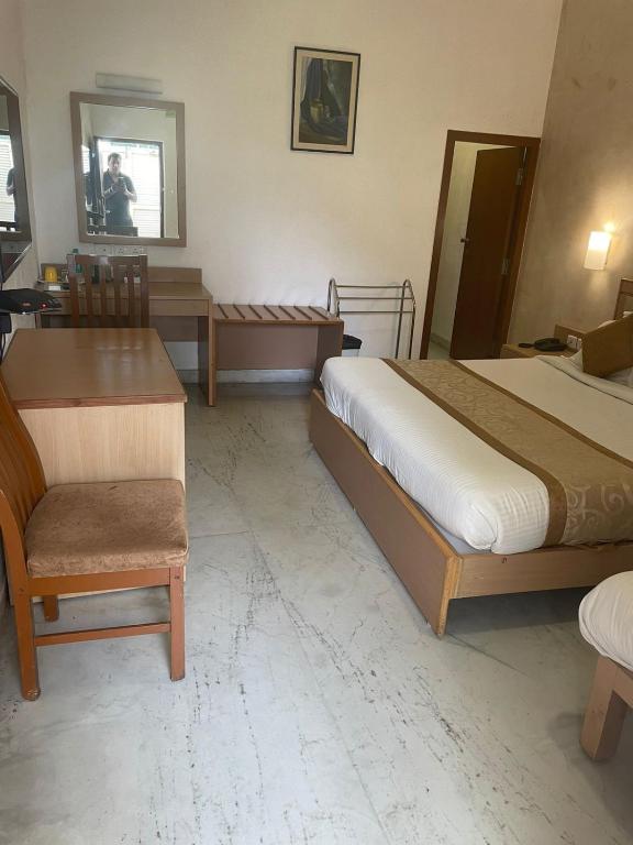 Postel nebo postele na pokoji v ubytování Avenue 11 Boutique Residences, Poes Garden Chennai