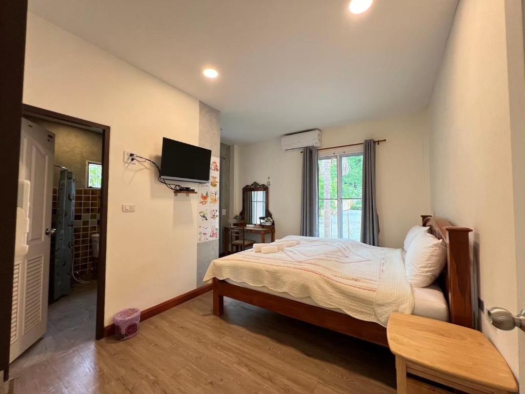 Postel nebo postele na pokoji v ubytování Pim's House Khao Yai