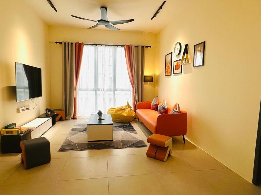 a living room with a couch and a ceiling fan at Sleek Cottage GLEN 1 HomeStay Kuching in Kuching