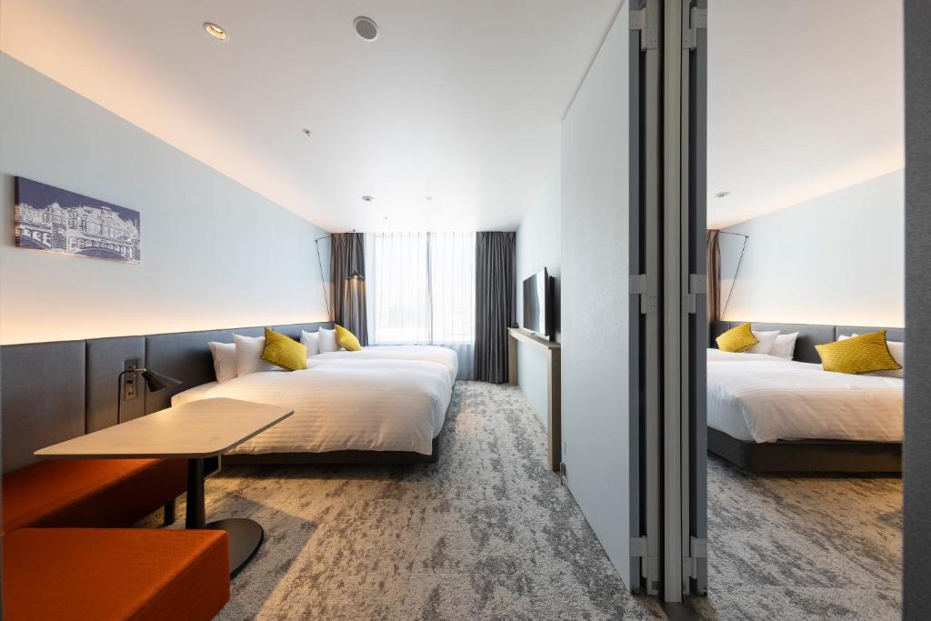 Postel nebo postele na pokoji v ubytování Hotel Intergate Osaka Umeda