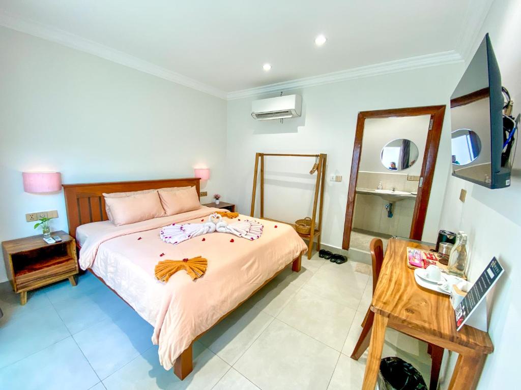 Postel nebo postele na pokoji v ubytování Muni Residence & Spa