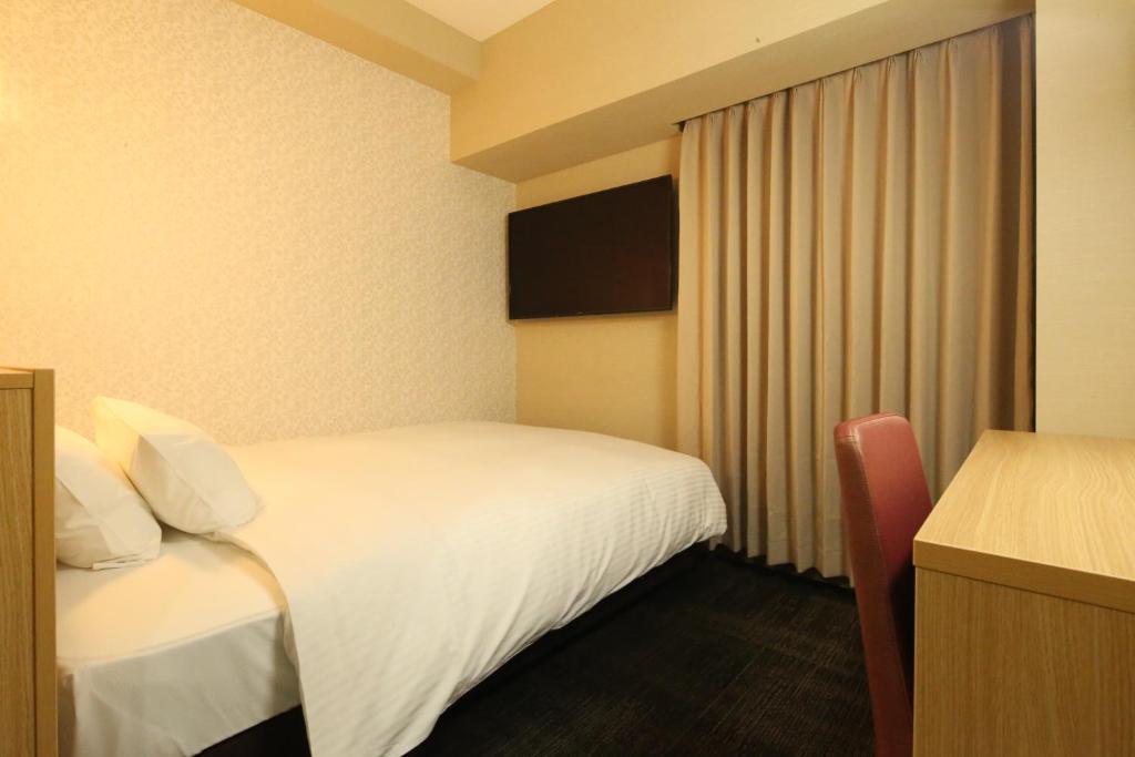 Postel nebo postele na pokoji v ubytování AB Hotel Hikone