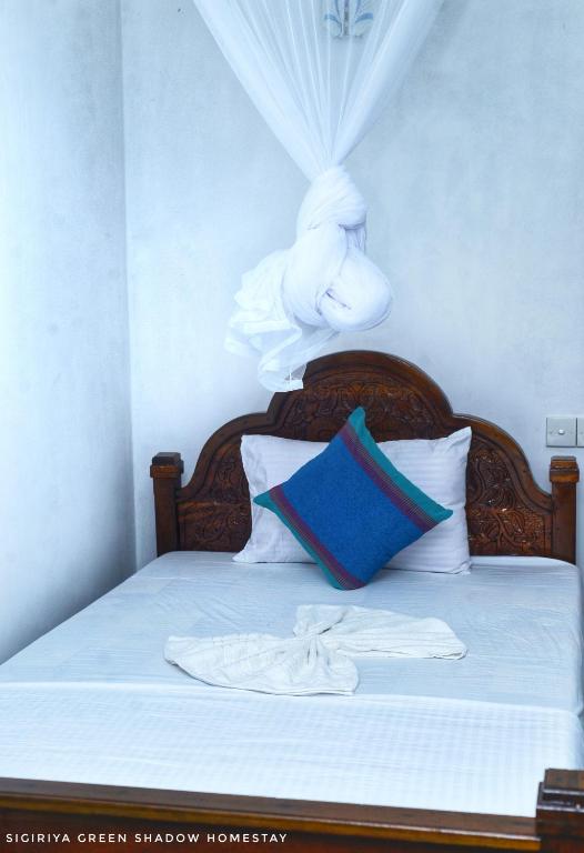 Postel nebo postele na pokoji v ubytování Sigiri Green Shadow Homestay