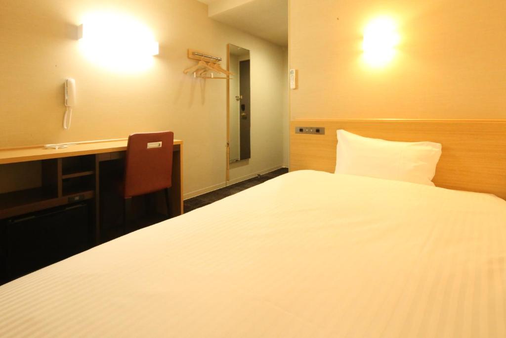 Postel nebo postele na pokoji v ubytování AB Hotel Hikone