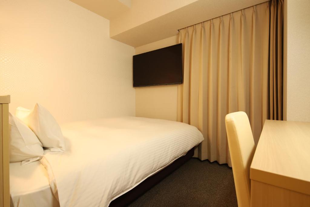 Postel nebo postele na pokoji v ubytování AB Hotel Shiojiri