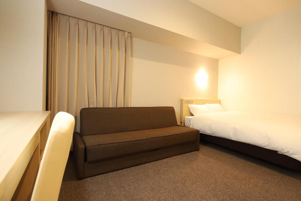 Postel nebo postele na pokoji v ubytování AB Hotel Shiojiri