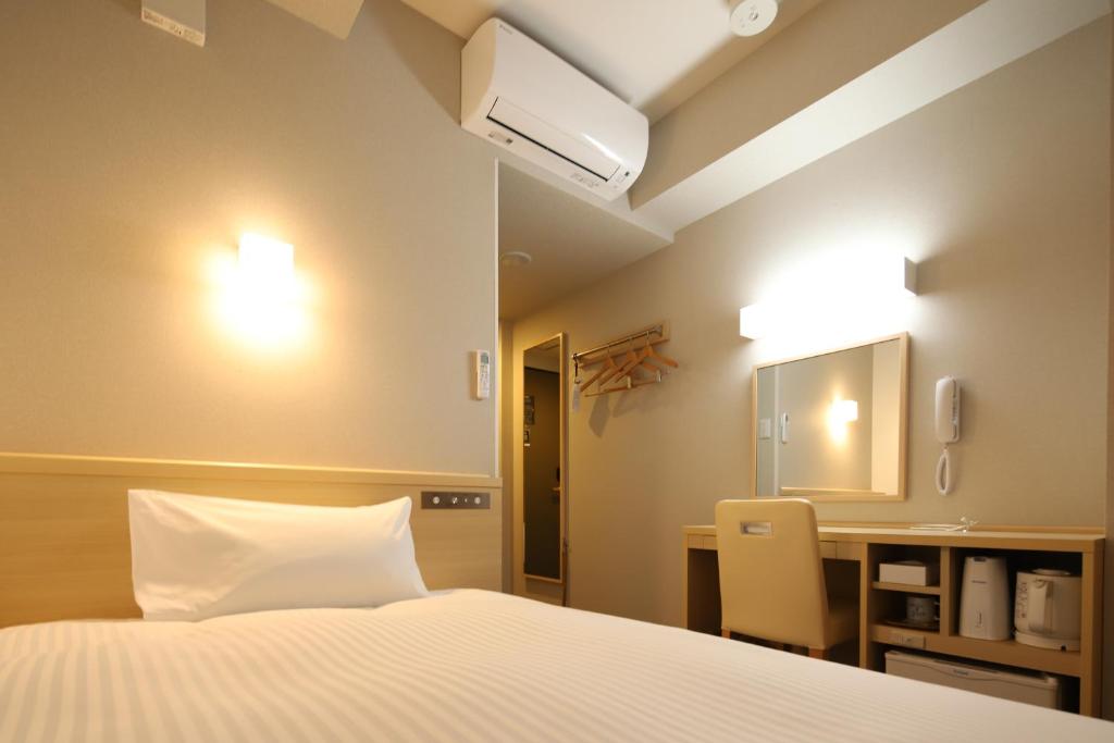 Postel nebo postele na pokoji v ubytování AB Hotel Shiojiri